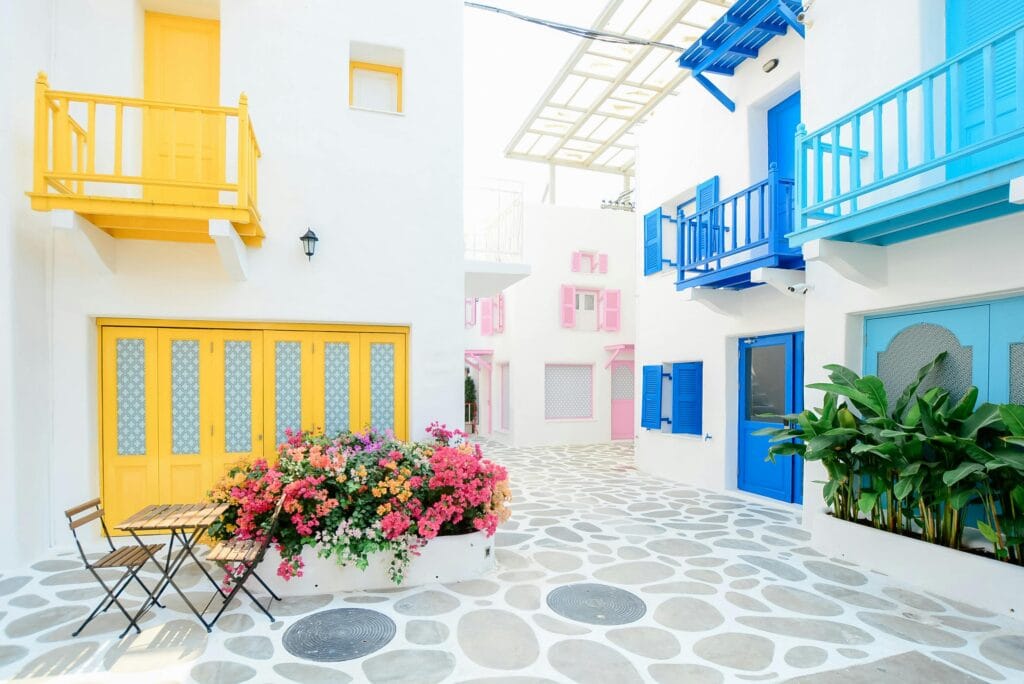 Vibrant Mediterranean architecture with colorful doors and balconies in Greece.